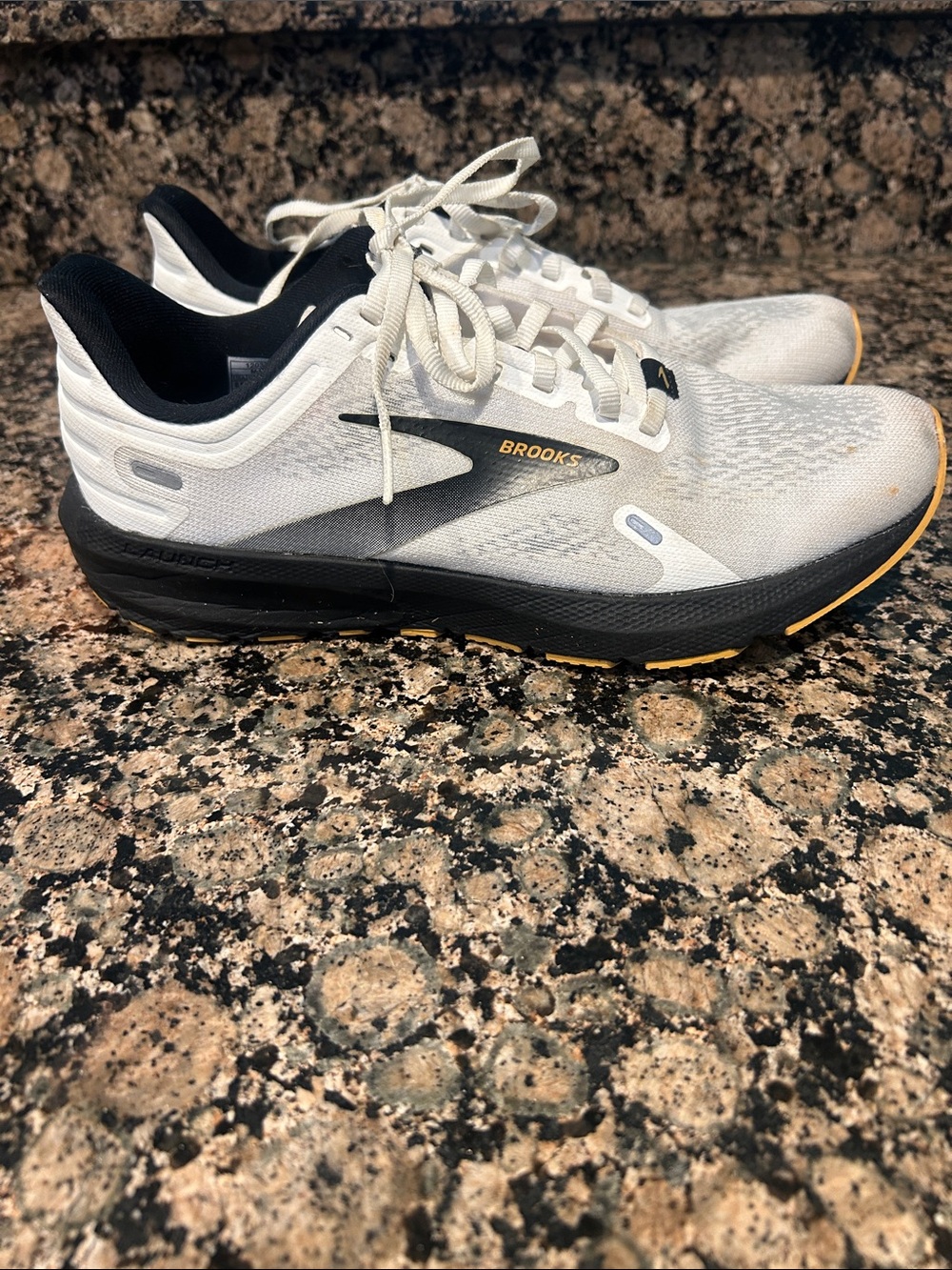 Brooks White and Black Men's Athletic Running Shoes with Yellow Accents